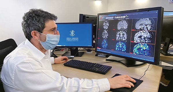 Dr. Savatovsky reviewing pCASL images at the Foundation Adolphe de Rothschild Hospital in Paris.